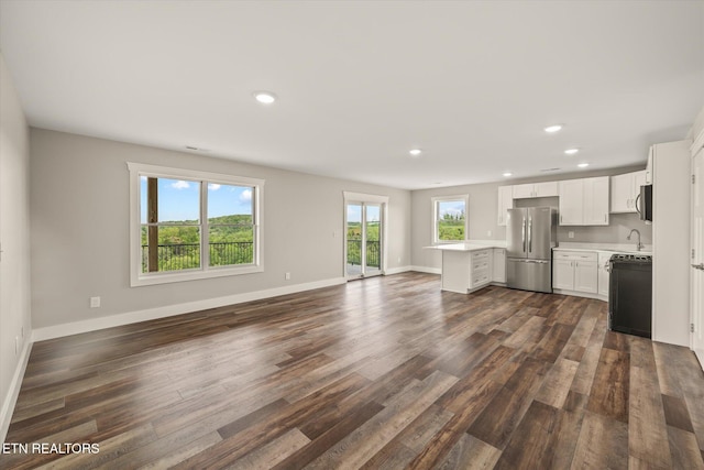 448 Taylor Rd, Byrdstown, TN 38549 - unfurnished living room with recessed lighting, baseboards, and dark wood finished floors