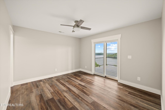 448 Taylor Rd, Byrdstown, TN 38549 - spare room featuring ceiling fan, visible vents, dark wood-style floors, and baseboards