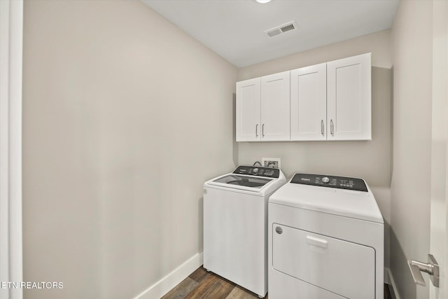 448 Taylor Rd, Byrdstown, TN 38549 - clothes washing area with cabinet space, separate washer and dryer, baseboards, visible vents, and dark wood-style floors