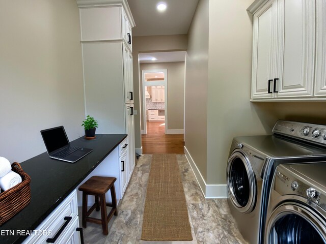laundry room featuring baseboards, recessed lighting, cabinet space, and washing machine and clothes dryer