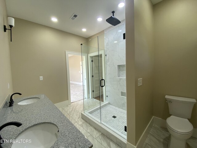 full bathroom featuring visible vents, a sink, marble finish floor, and a stall shower