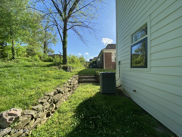 view of yard with central AC unit