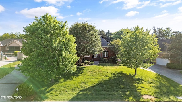 1614 Pinnacle Point Dr, Alcoa, TN 37701 - view of front of house featuring a garage and a front lawn