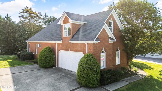 1614 Pinnacle Point Dr, Alcoa, TN 37701 - view of property exterior with a shingled roof, an attached garage, driveway, and brick siding