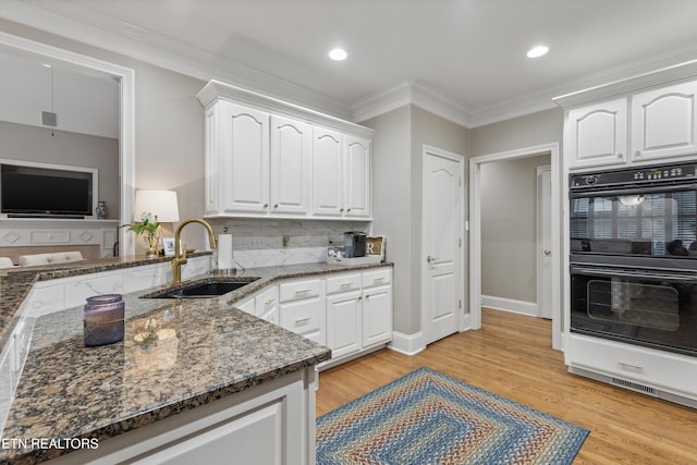 1614 Pinnacle Point Dr, Alcoa, TN 37701 - kitchen with dobule oven black, crown molding, a sink, dark stone counters, and white cabinetry