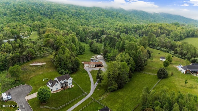 bird's eye view featuring a wooded view