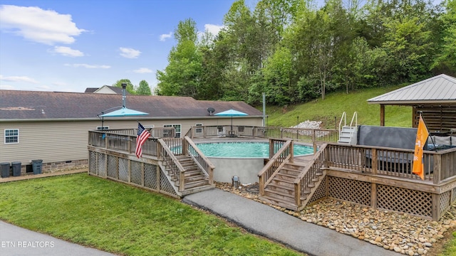 outdoor pool with stairs, a yard, and a deck