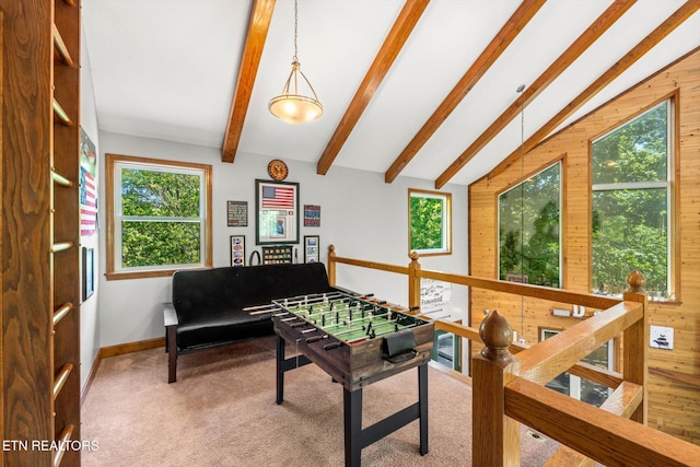 recreation room featuring wooden walls, carpet flooring, lofted ceiling with beams, and baseboards