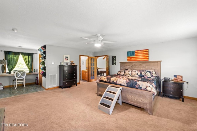 bedroom with visible vents, carpet, ceiling fan, and baseboards