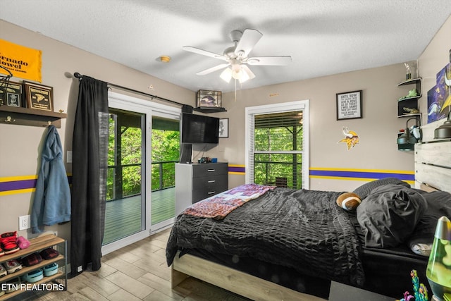 bedroom featuring access to outside, a textured ceiling, ceiling fan, and wood finished floors