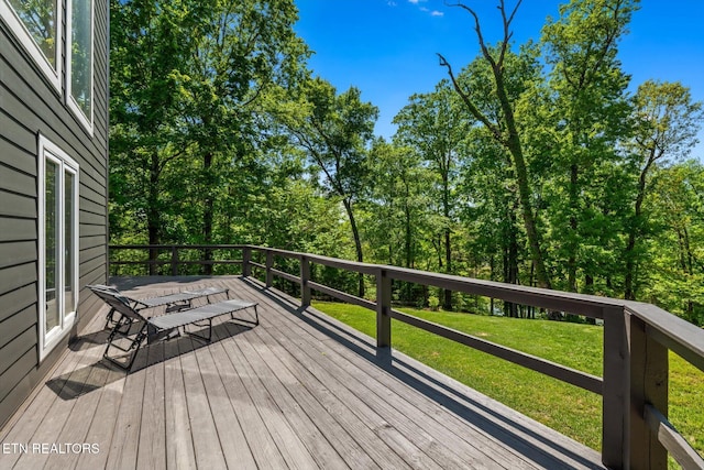 deck featuring a lawn