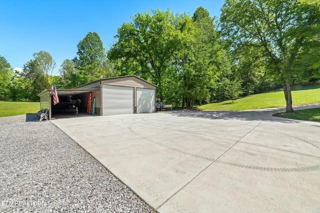 garage featuring a detached garage and concrete driveway