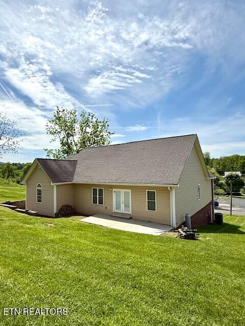 217 Loomis St, Tellico Plains, TN 37385 - back of house featuring a yard, a patio, and french doors