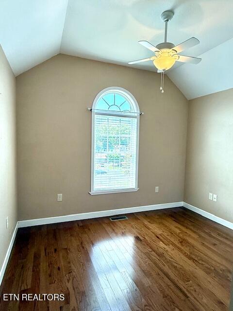 217 Loomis St, Tellico Plains, TN 37385 - spare room featuring a ceiling fan, visible vents, vaulted ceiling, wood finished floors, and baseboards
