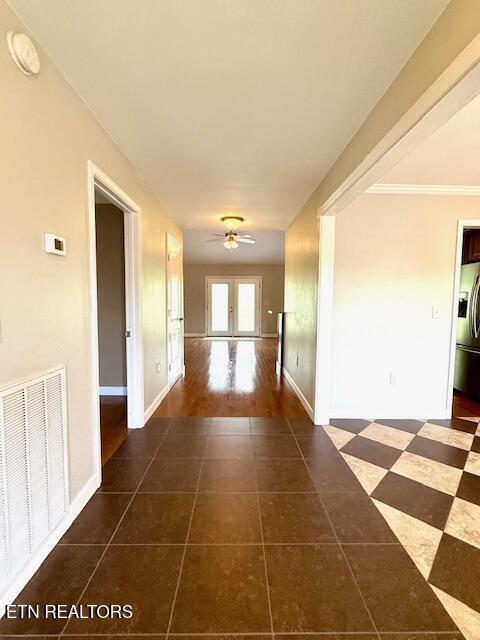 217 Loomis St, Tellico Plains, TN 37385 - hallway with visible vents, dark tile patterned floors, and baseboards