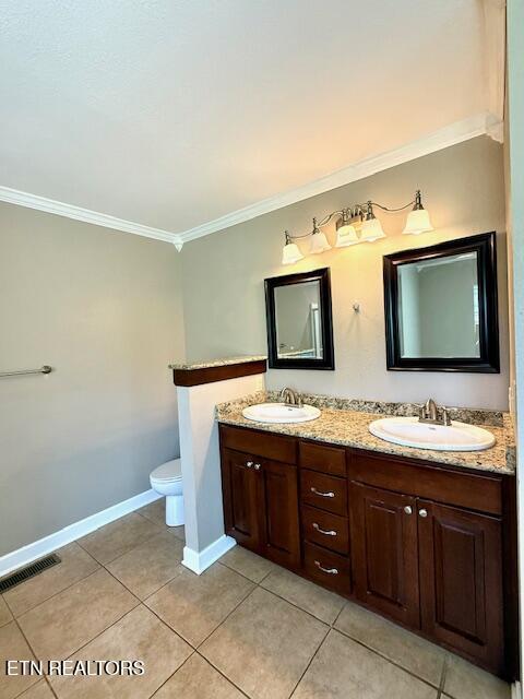 217 Loomis St, Tellico Plains, TN 37385 - full bath featuring tile patterned floors, visible vents, ornamental molding, and a sink