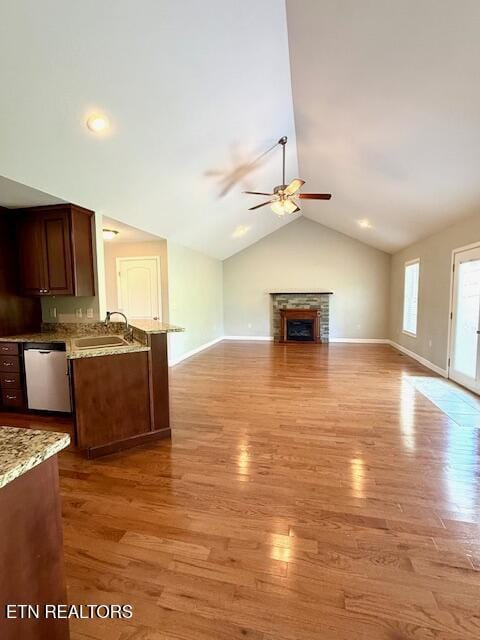 217 Loomis St, Tellico Plains, TN 37385 - unfurnished living room with a sink, vaulted ceiling, a ceiling fan, and light wood finished floors