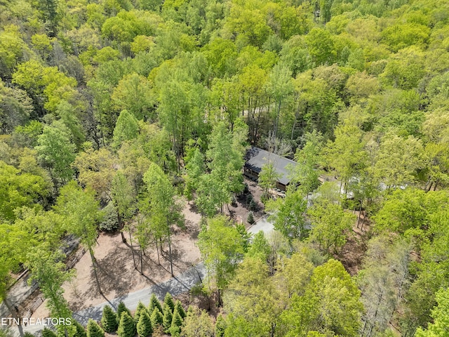drone / aerial view featuring a view of trees