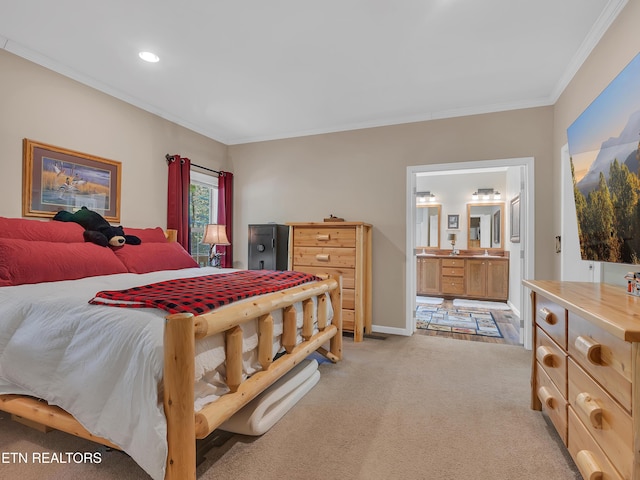 bedroom featuring light colored carpet, crown molding, baseboards, connected bathroom, and recessed lighting