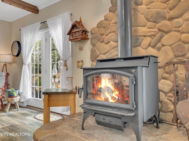 room details with a wood stove and ornamental molding
