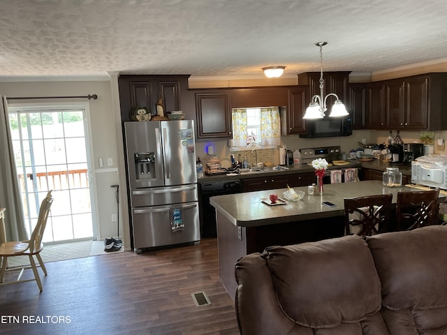 kitchen with a sink, plenty of natural light, black appliances, and dark brown cabinets