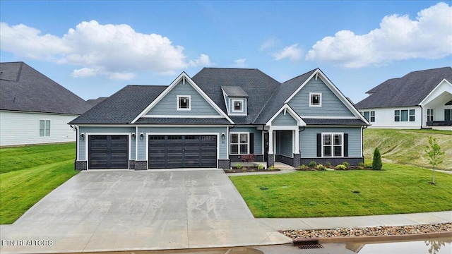 342 Bittersweet Ln, Lenoir City, TN 37771 - craftsman-style house with an attached garage, a front lawn, concrete driveway, and covered porch