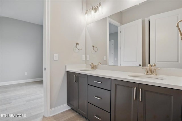 342 Bittersweet Ln, Lenoir City, TN 37771 - bathroom with double vanity, wood finished floors, and baseboards