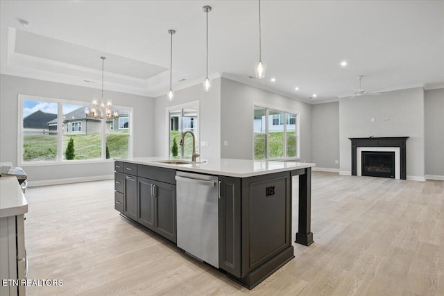 342 Bittersweet Ln, Lenoir City, TN 37771 - kitchen featuring stainless steel dishwasher, a sink, baseboards, light wood-type flooring, and crown molding