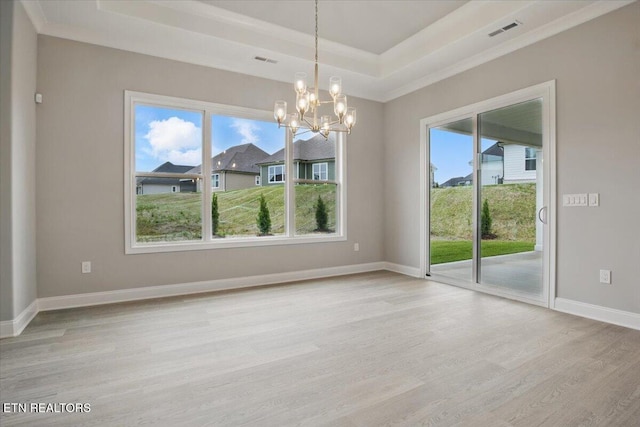 342 Bittersweet Ln, Lenoir City, TN 37771 - spare room with wood finished floors, a chandelier, a raised ceiling, baseboards, and crown molding