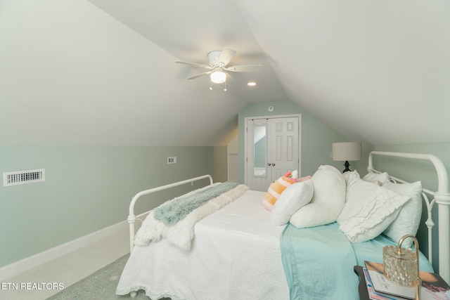carpeted bedroom with baseboards, a ceiling fan, lofted ceiling, and visible vents