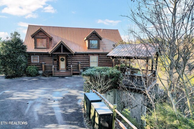 4430 Shangrila Way, Sevierville, TN 37876 - log home featuring a porch, driveway, log exterior, and metal roof