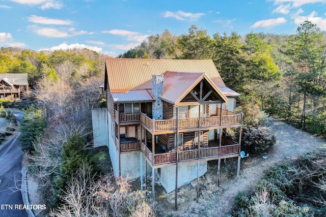 4430 Shangrila Way, Sevierville, TN 37876 - rear view of property with a view of trees, metal roof, and a balcony