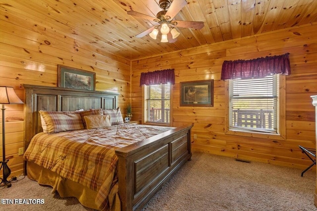 4430 Shangrila Way, Sevierville, TN 37876 - bedroom featuring carpet flooring, ceiling fan, wood walls, and wooden ceiling