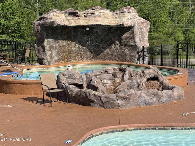 212 Forrest Loop Way, Gatlinburg, TN 37738 - view of pool featuring an outdoor hot tub and fence