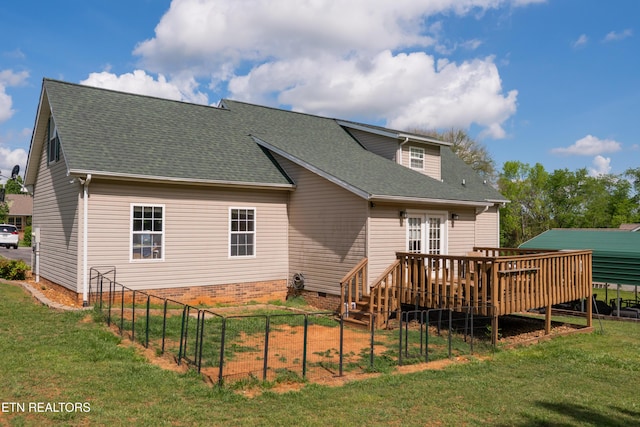 rear view of house with a shingled roof, crawl space, a yard, and a deck