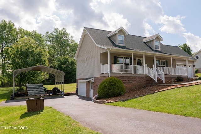 new england style home featuring a porch, a carport, aphalt driveway, an attached garage, and a front lawn