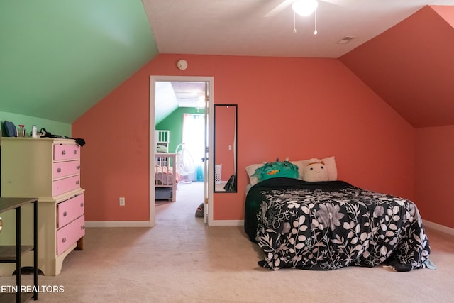 carpeted bedroom with baseboards, a ceiling fan, and lofted ceiling
