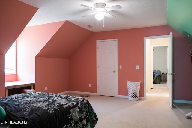 bedroom with a ceiling fan, visible vents, light colored carpet, baseboards, and lofted ceiling