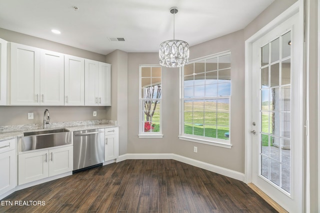 kitchen with stainless steel dishwasher, a sink, baseboards, dark wood-style floors, and a chandelier
