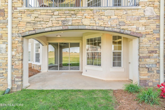 view of exterior entry with stone siding