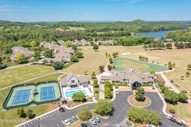 aerial view featuring a water view and a forest view