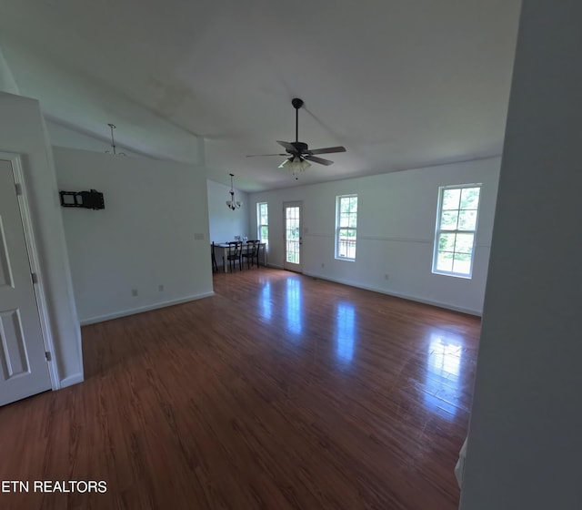 2094 NW Cecil Johnson Rd, Knoxville, TN 37921 - unfurnished living room with a ceiling fan, wood finished floors, baseboards, and a chandelier