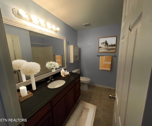 2094 NW Cecil Johnson Rd, Knoxville, TN 37921 - bathroom with vanity, tile patterned flooring, baseboards, a shower, and toilet