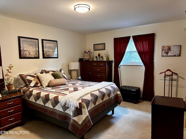 bedroom with light colored carpet