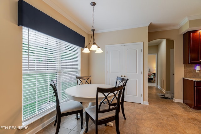 1827 Autumn Bluff Rd, Knoxville, TN 37932 - dining area with arched walkways, healthy amount of natural light, ornamental molding, baseboards, and light tile patterned floors