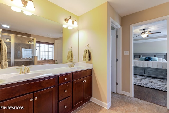 1827 Autumn Bluff Rd, Knoxville, TN 37932 - ensuite bathroom with double vanity, a tile shower, ceiling fan, baseboards, and tile patterned flooring