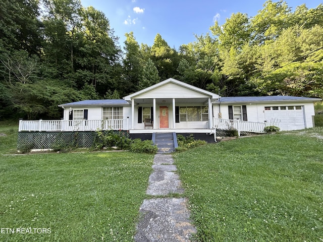 3510 Briceville Hwy, Briceville, TN 37710 - view of front of house featuring a porch, an attached garage, and a front yard
