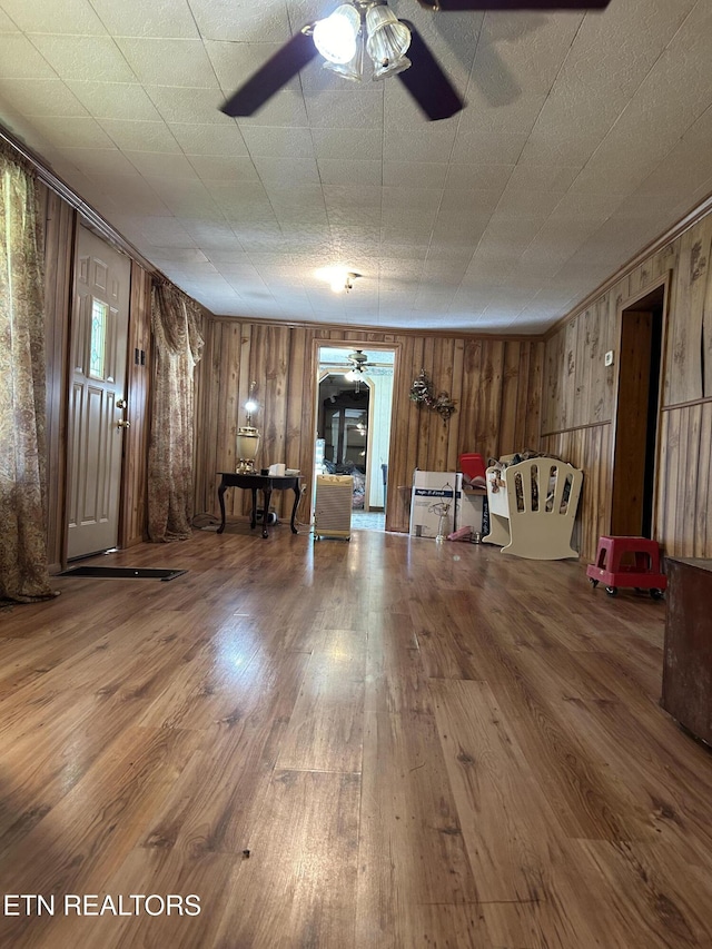 3510 Briceville Hwy, Briceville, TN 37710 - interior space featuring wooden walls, a ceiling fan, and wood finished floors