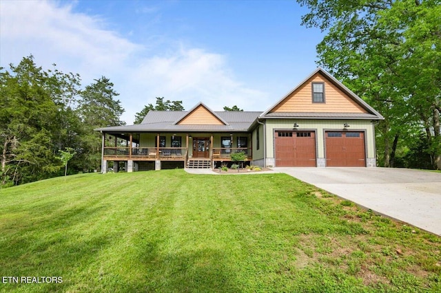 view of front of house featuring a porch, a garage, driveway, and a front lawn