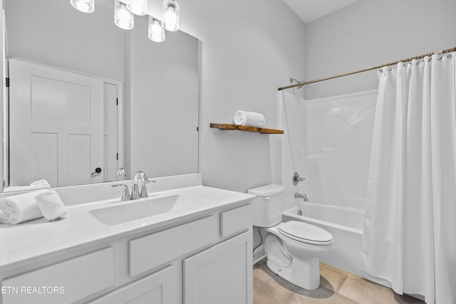 bathroom with vanity, shower / bath combo, and toilet